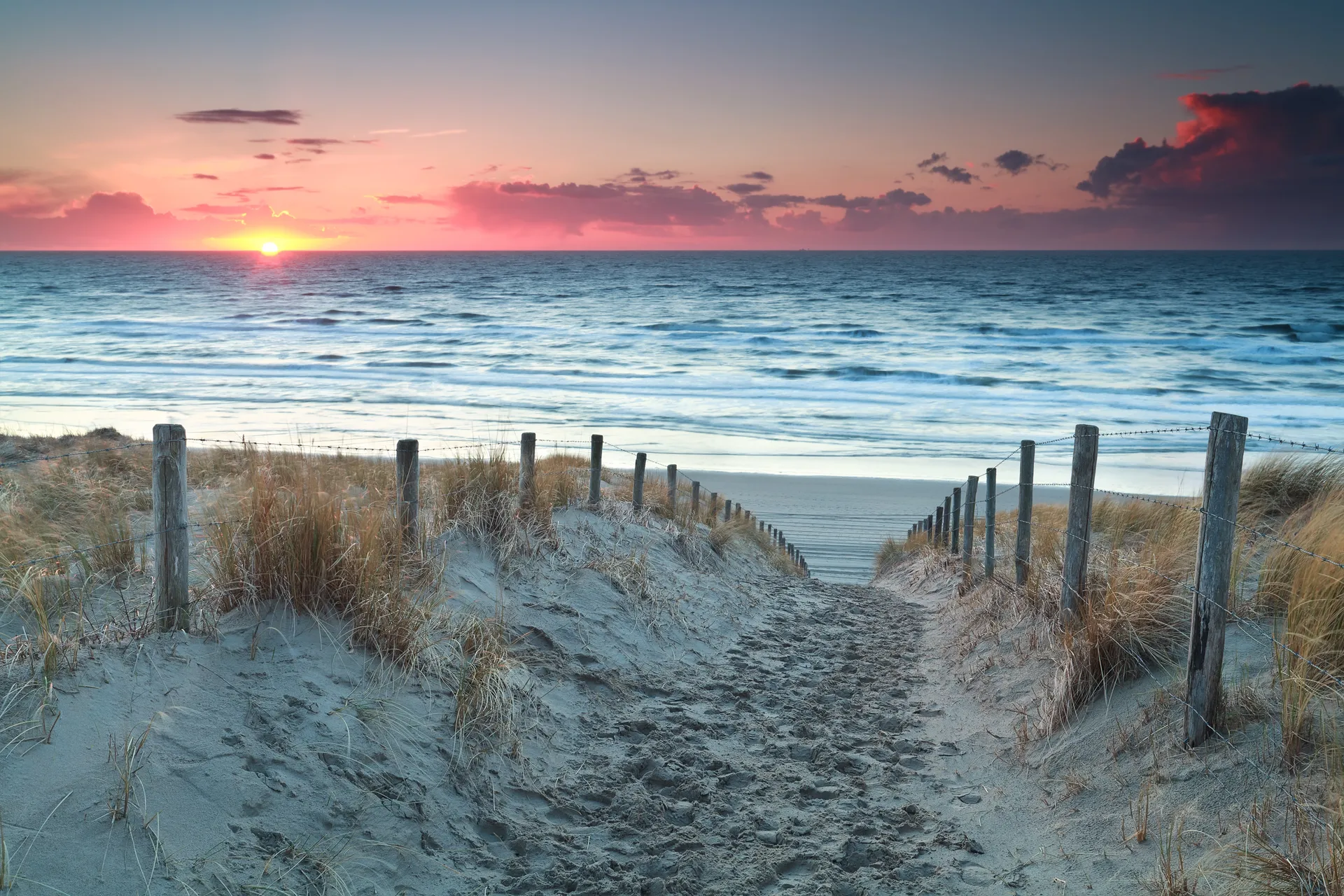 Dune path to the beach at sunset in Zandvoort near Ocean House Zandvoort