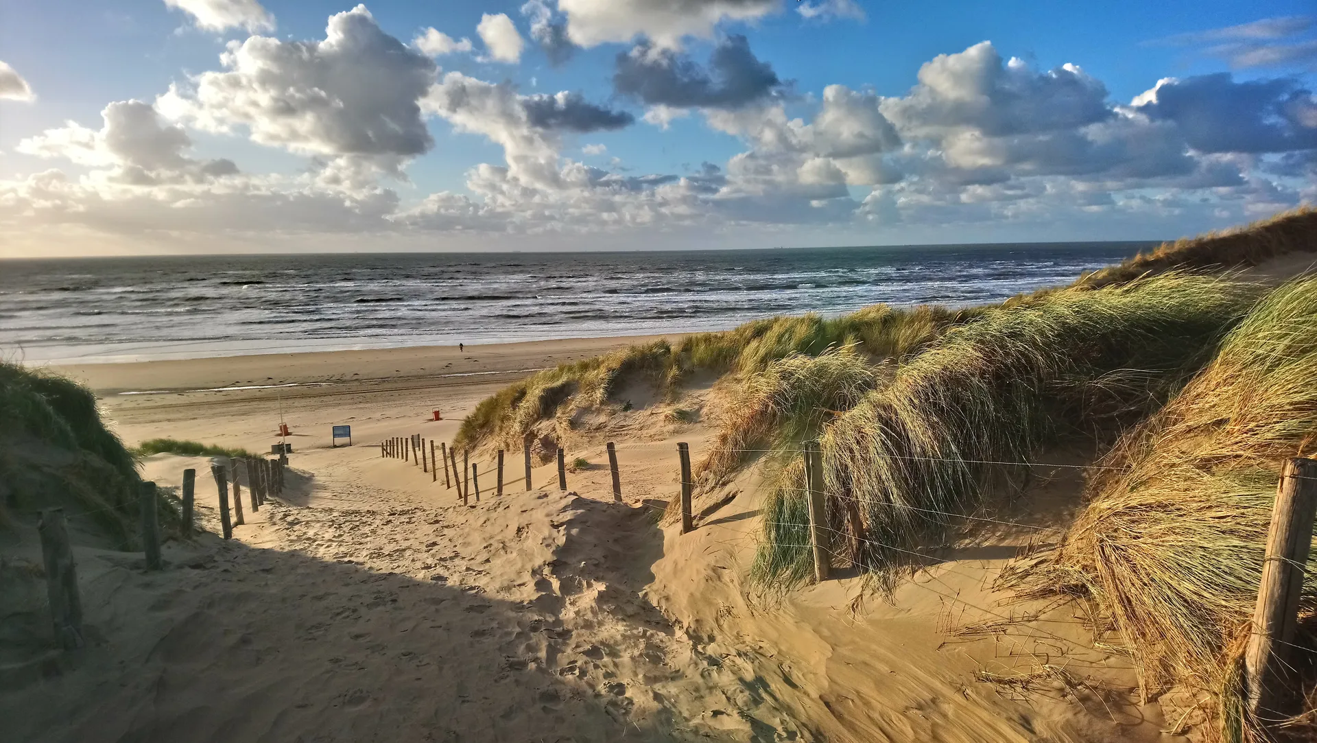 Zandvoort dunes and beach under a dramatic cloudy sky near Ocean House Zandvoort